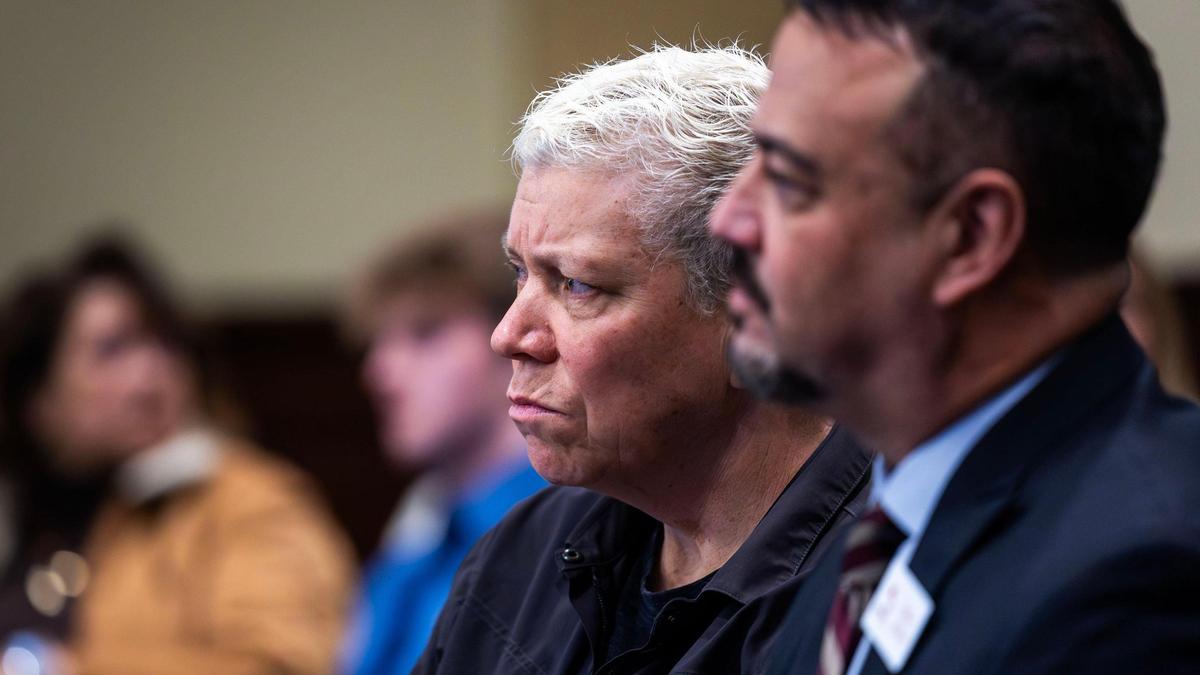 Sue Latta, of Boise, listens as Rep. Heather Scott, R-Blanchard, presented a symbolic measure opposing same-sex marriage before a House committee Wednesday.
