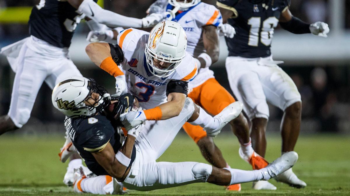Boise State linebacker Brandon Hawkins times a hard hit on UCF wide receiver Titus Mokiao-Atimalala on a punt last season in the season-opening game in Orlando. Hawkins is competing to replace Riley Whimpey at weakside linebacker this year.