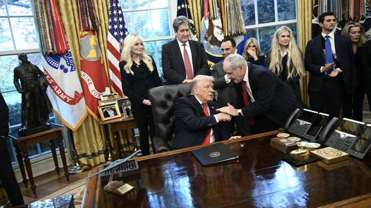 US President Donald Trump shakes hands with US Senator James Risch, Republican from Idaho during a swearing-in ceremony for the newly appointed Ambassador to India Sergio Gor in the Oval Office of the White on November 10, 2025 in Washington, DC. (Photo by Brendan SMIALOWSKI / AFP) (Photo by BRENDAN SMIALOWSKI/AFP via Getty Images)          