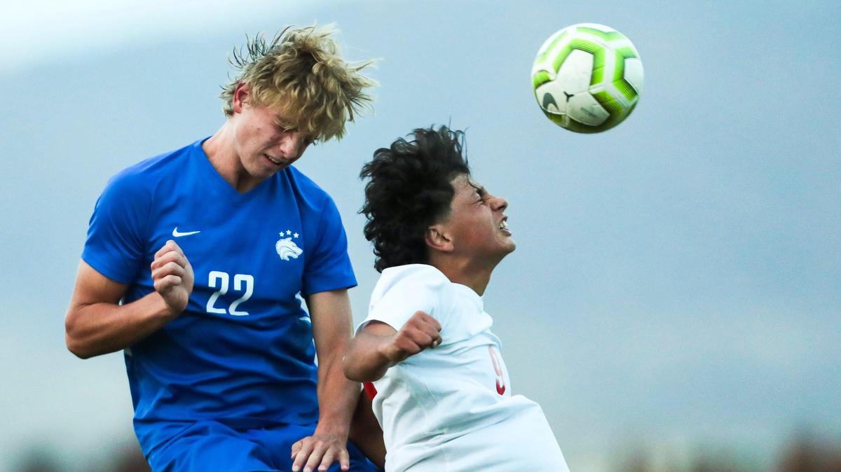 Timberline junior Jake Anderson wins a ball in the air over Boise’s Kyle McAllister on Monday at Timberline High School The Wolves won 1-0 to clinch the 5A SIC regular-season title.