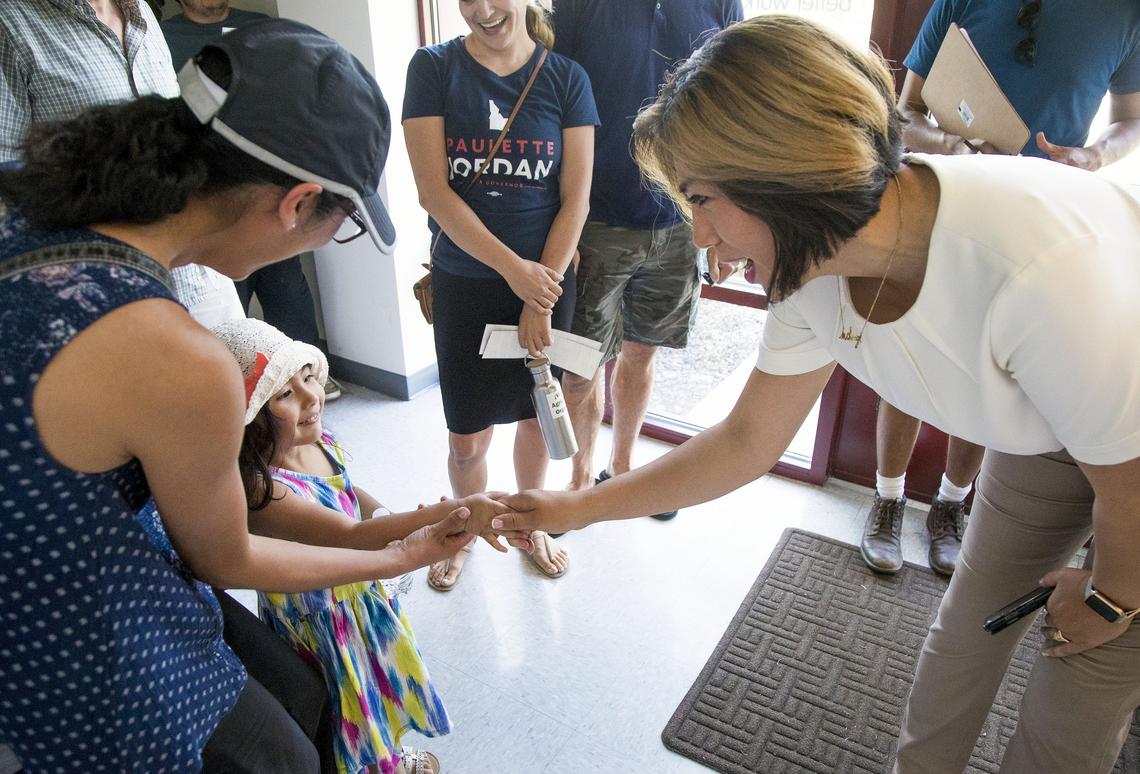 Lucia Sinche-Frias, 3, shakes the hand of Democratic gubernatorial candidate Paulette Jordan on Aug. 15, 2018 at the opening of Jordan’s campaign headquarters in Downtown Boise. Marleni Sinche, left, Lucia’s mother, said they traveled from Nampa to get stickers and were excited to meet Jordan.