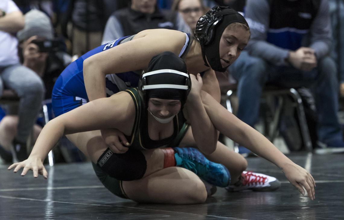 Timberline’s Mercedes Ellison gets an upper hand on Borah’s Kayli Acosta in the 138-145 pound girls division of the Rollie Lane Invitational Friday, Jan. 4, 2019 at the Idaho Center in Nampa. Ellison advanced with a 7-0 decision in the championship bracket.
