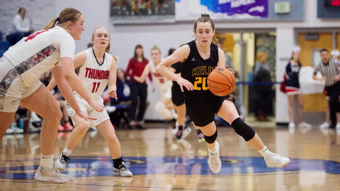 Bishop Kelly senior Logan J McCarthy dribbles the ball in the fourth quarter during the 4A state girls basketball tournament quarterfinals on Thursday at Timberline High School. Bishop Kelly won 51-33 over Pocatello.