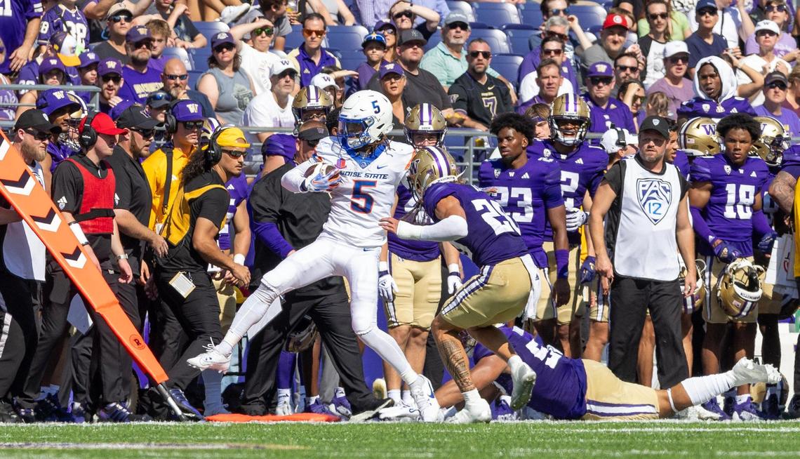 Boise State wide receiver Stefan Cobbs is pushed out-of-bounds by Washington safety Asa Turner in the third quarter of their game against University of Washington at Husky Stadium in Seattle, Saturday, Sept. 2, 2023.
