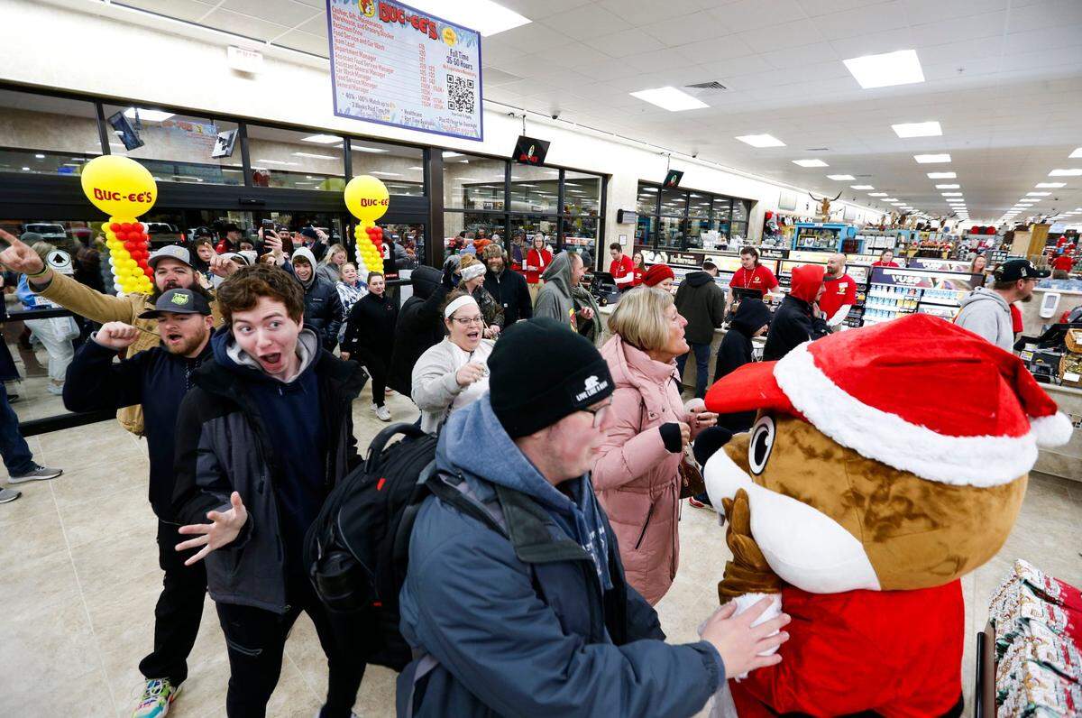 Buc-ee’s fans scurry inside as Missouri’s first Buc-ee’s opens for business in December 2023.