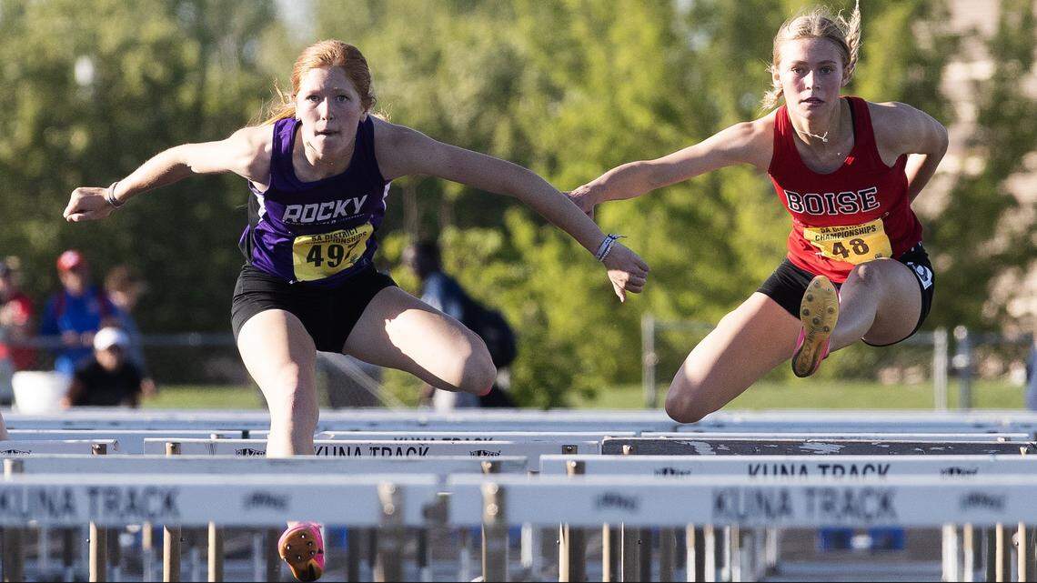 Rocky Mountain’s Hannah Pinegar, left, competes in the 100-meter hurdles at the 5A District Three track meet held at Kuna High School last May. Pinegar placed first.