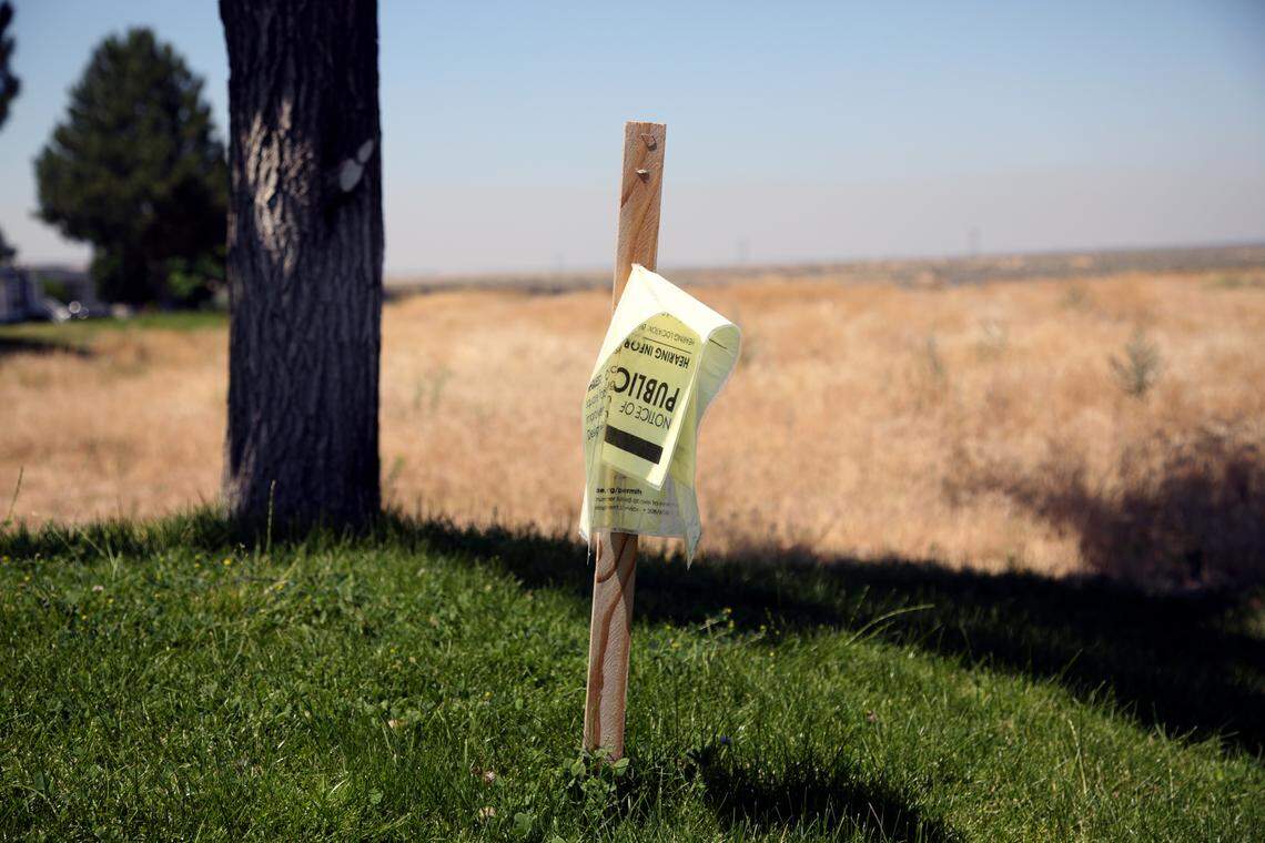 Residents at the Blue Valley mobile home park argue that the city should have done a better job of notifying them of the proposed truck terminal and the public hearings about its future. This sign announcing a June 13 hearing was worse for wear by July.
