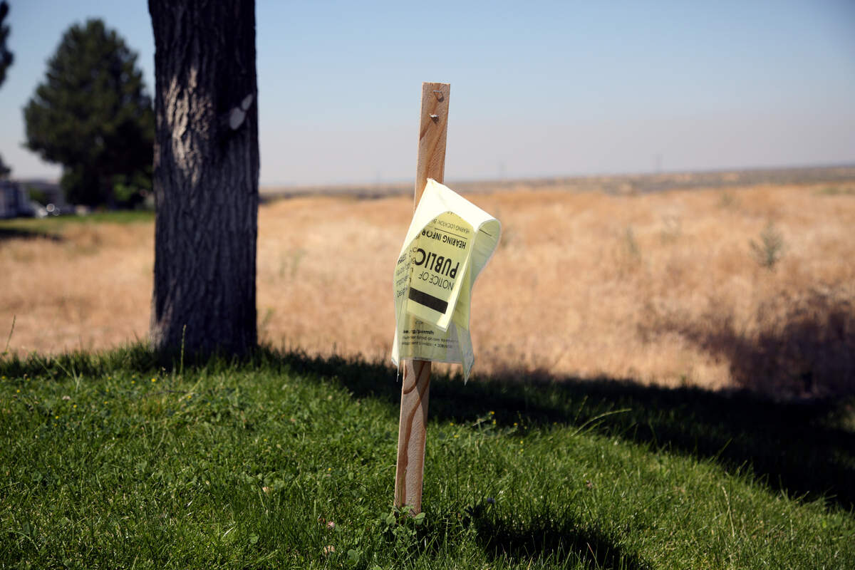 Residents at the Blue Valley mobile home park argue that the city should have done a better job of notifying them of the proposed truck terminal and the public hearings about its future. This sign announcing a June 13 hearing was worse for wear by July.