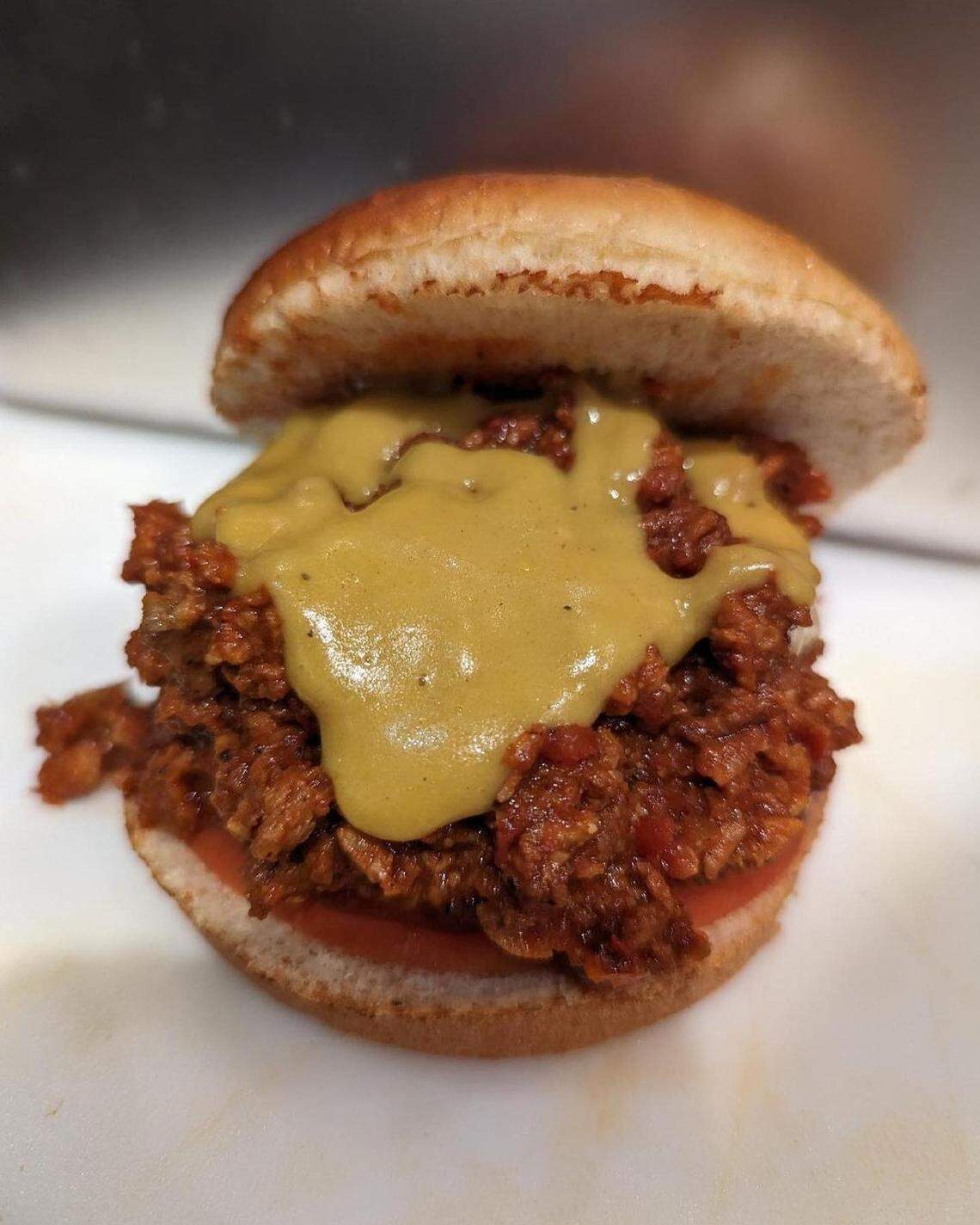 Sloppy Joe: taco “meat,” organic sliced tomato, house barbecue sauce and cheddar sauce.