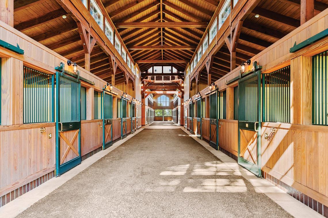 The horse barn features 18 stalls, shown here, along with a foaling stall, wash rack and vet room.