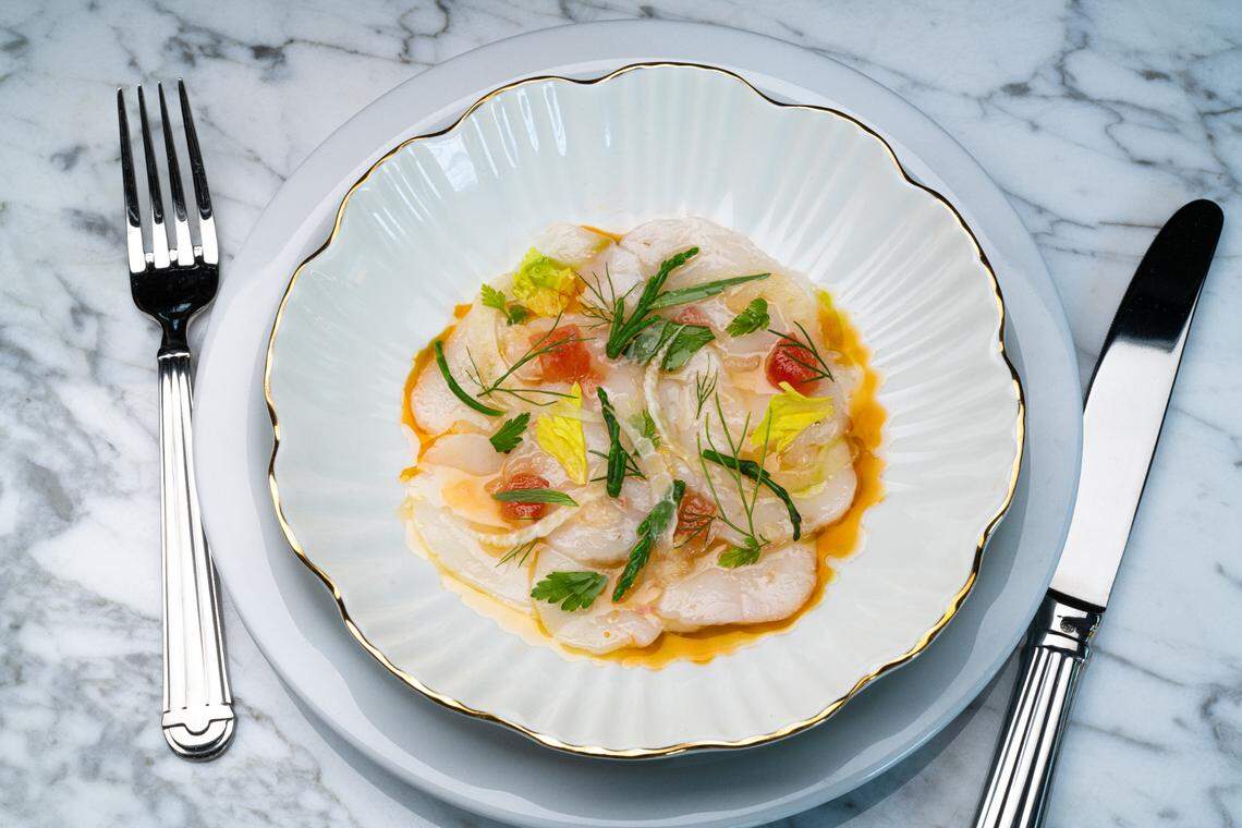 Scallup Crudo ($21) is a starter that features tomato vinaigrette, sea beans, shaved fennel, black olives and herbs.