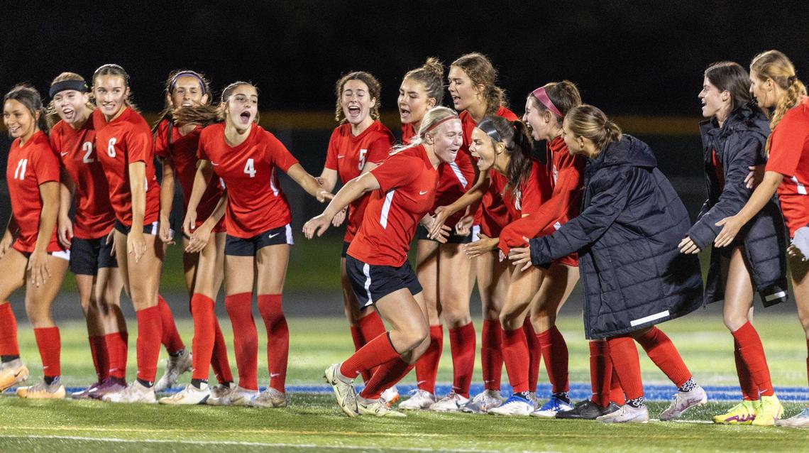 Boise’s Sammy Smith high-fives her teammates after scoring her penalty kick Wednesday at Mountain View.