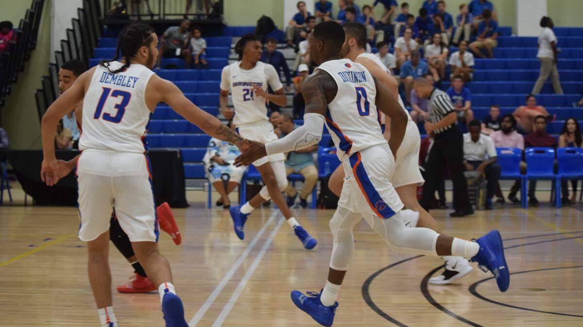 Boise State guards Pat Dembley, left, and Marcus Dickinson share a celebratory five in a 73-70 loss to Illinois State on Wednesday at the Cayman Islands Classic in George Town, Grand Cayman.