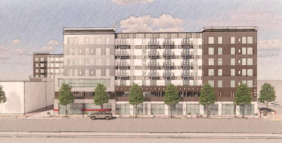 A rendering of River Caddis’ apartment building, with four levels of apartments, a parking garage on the ground floor and a pool deck on the top.