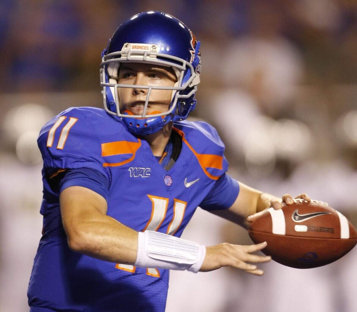 Boise State quarterback Kellen Moore completes a pass in the first quarter in the Broncos' season opener with Oregon at Bronco Stadium in Boise, Thursday, Sept. 3, 2009.