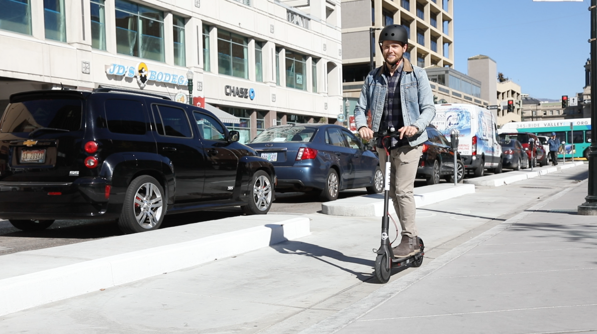 Hey wait, is that dude riding a Bird e-scooter the wrong way in the protected bike lane in front of City Hall? At least he’s wearing a helmet?