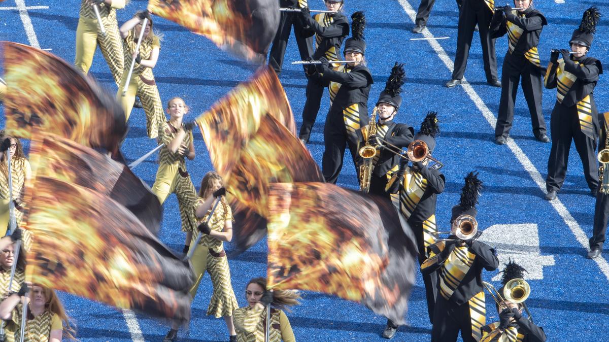 In this 2019 file photo, Kuna Gold Band and color guard perform at the District III high school marching band competition at Albertsons Stadium.