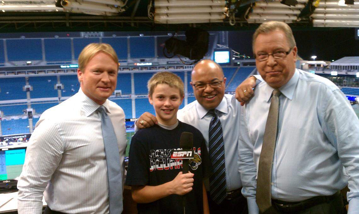 Boise State wide receiver Davis Koetter poses with the former Monday Night Football broadcast crew. From left: John Gruden, Mike Tirico and Ron Jaworski.