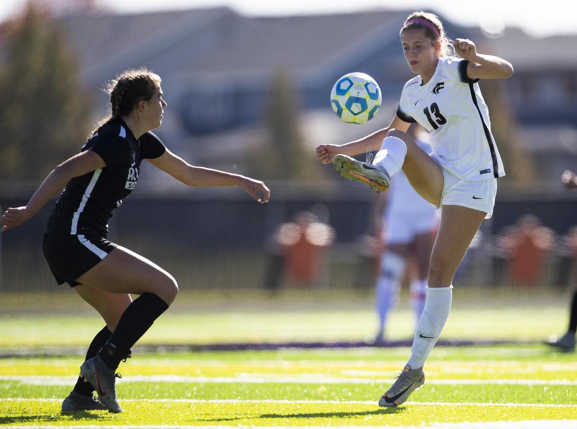 Timberline midfielder London Carter, right, is one of six returning starters for the Wolves.