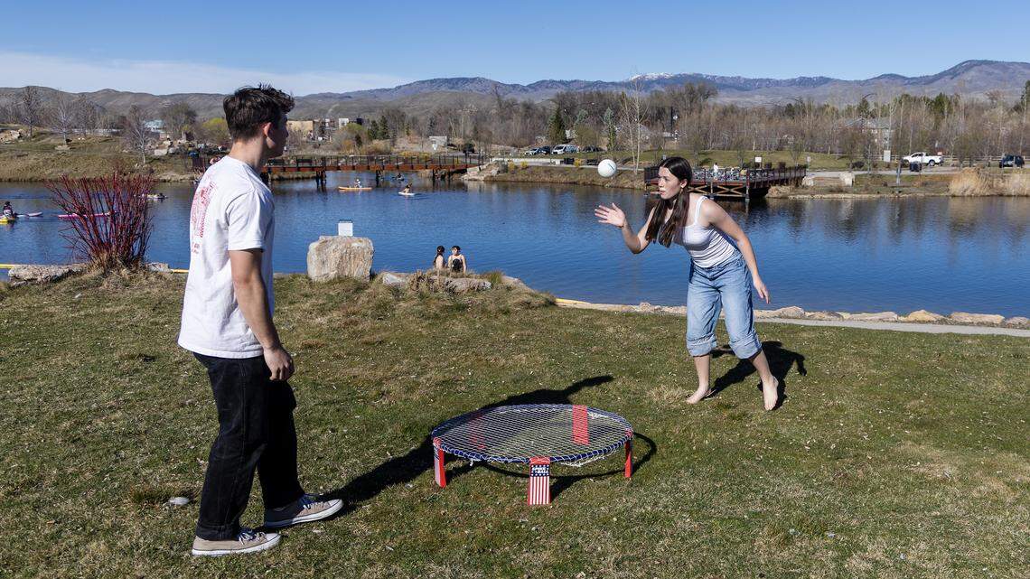 Siblings Parley and Veda Carvajal, 15, play spike ball at Esther Simplot Park in Boise in March 2026 during a record-setting heat wave.