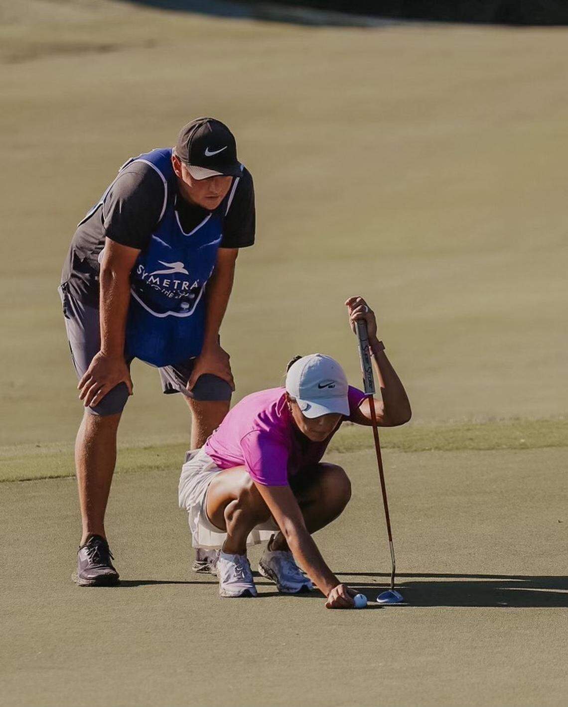 Gabby Lemieux, right, is in her fifth season as a professional golfer. Her husband, Jared Lemieux, often serves as her caddie.