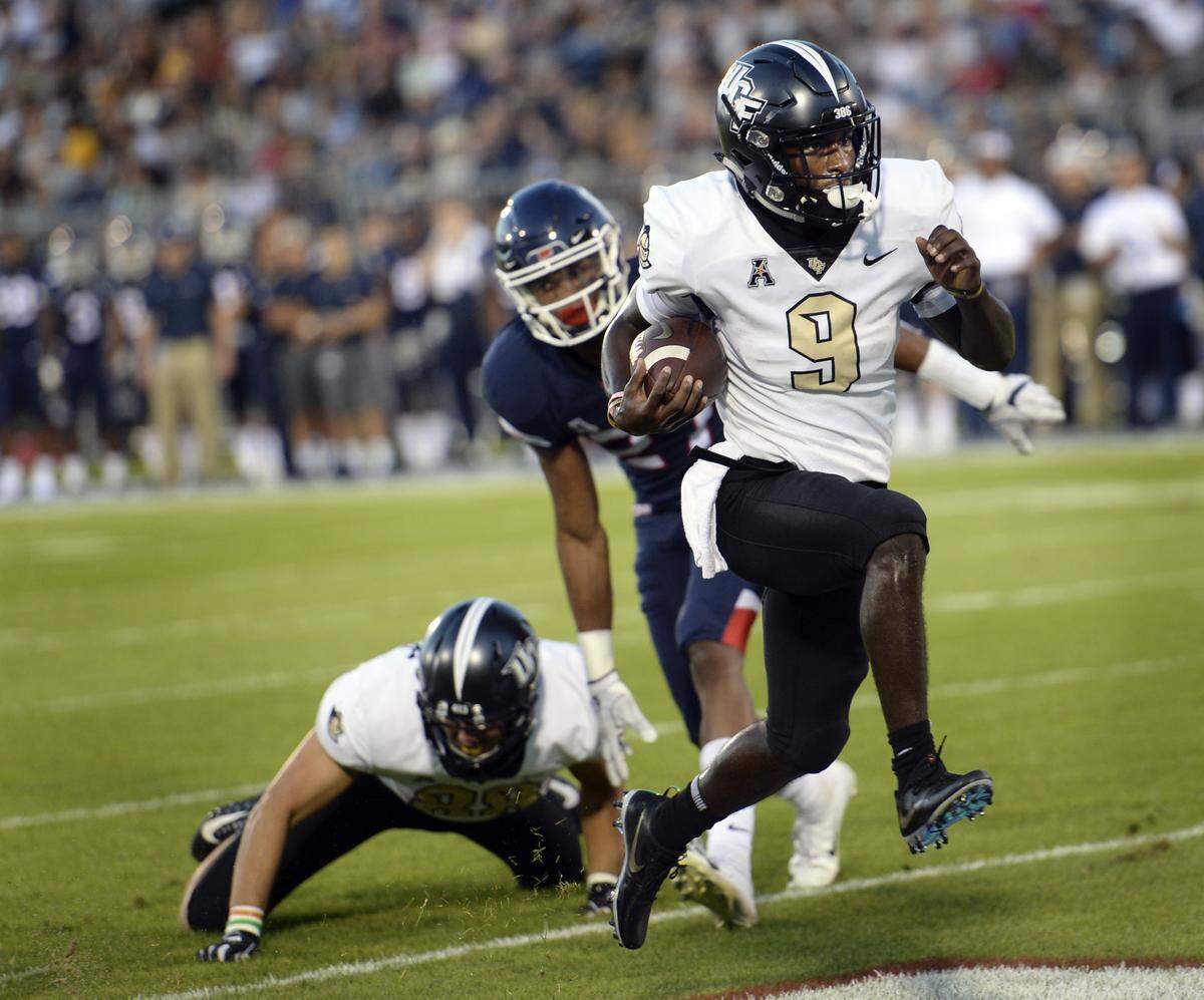 Central Florida running back Adrian Killins Jr. runs the ball in for a touchdown Aug. 30 against Connecticut.