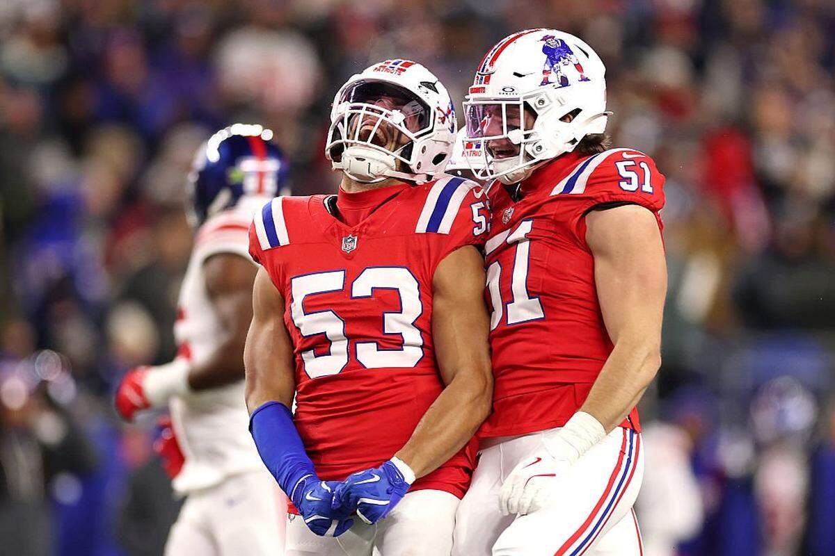 New England’s Christian Elliss, left, celebrates with Jack Gibbens after a stop against the New York Giants on Dec. 1 at Gillette Stadium in Foxborough, Massachusetts.