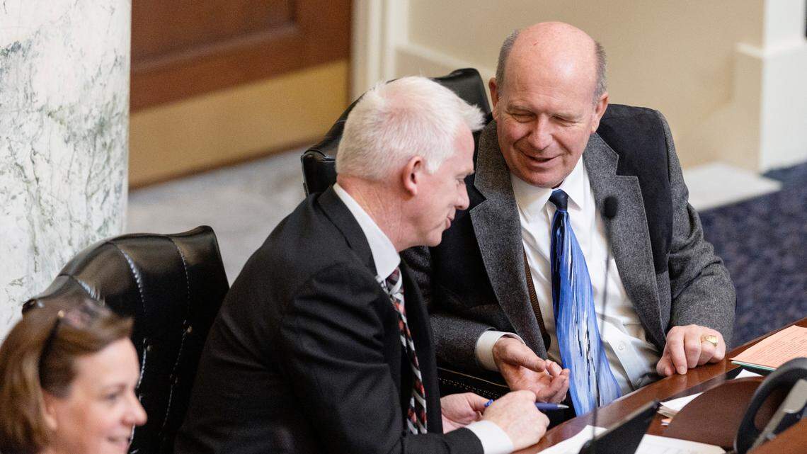 Reps. Jason Monks, R-Meridian, and Mike Moyle, R-Star, talk during the House session on Wednesday, March 16, 2022. Monks and Moyle are both hoping to be the Idaho House’s next speaker.