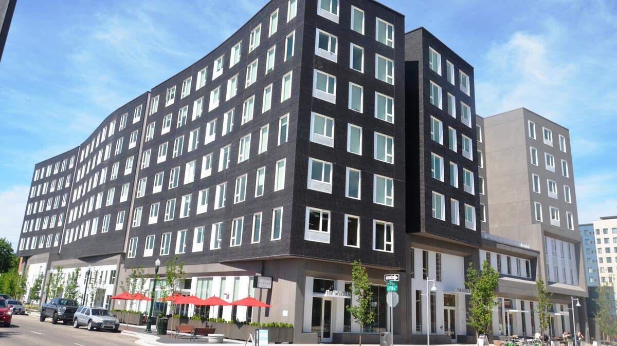 The seven-story Fowler apartments opened at 505 W. Broad St. in March. Construction was substantially completed in late March, nearly nine months after the date specified by the construction contract. Developers of the 159-unit building are suing Andersen Construction of Portland, the builder.