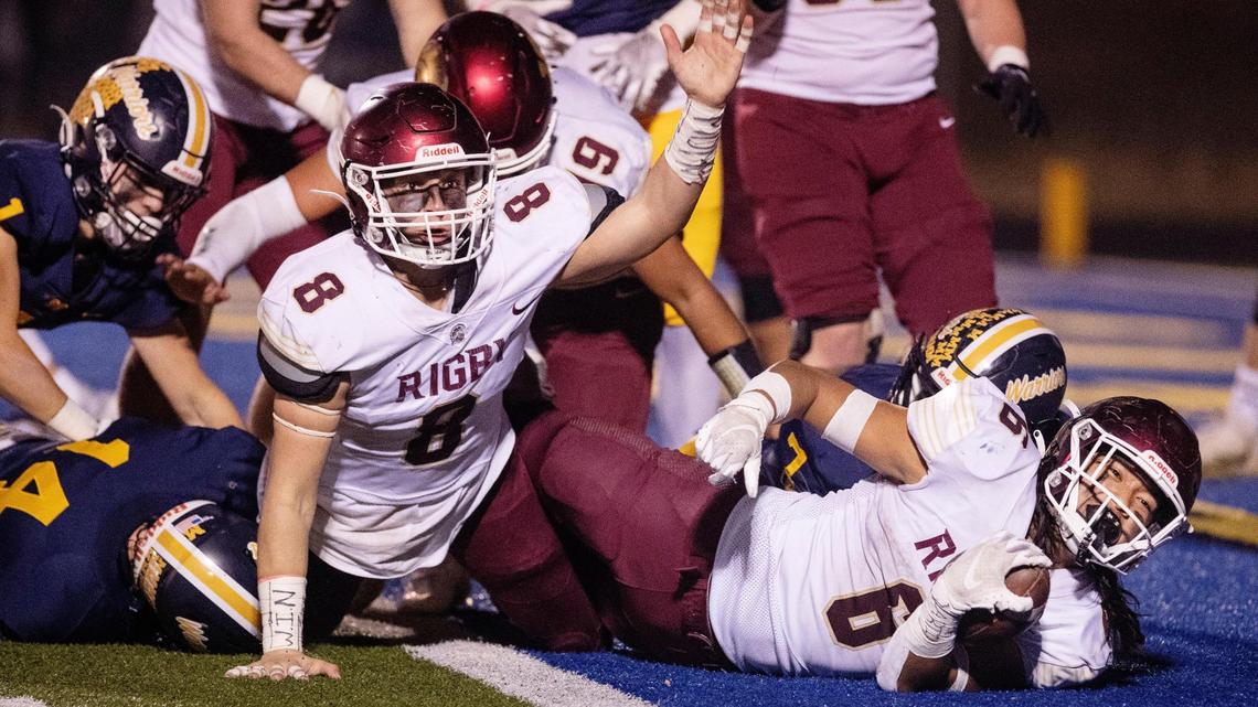 Rigby running back Zheik Falevai, right, scores a two-point conversion in the second quarter Friday at Meridian High. Rigby beat the Warriors 55-49 in triple overtime in the 5A state semifinals.