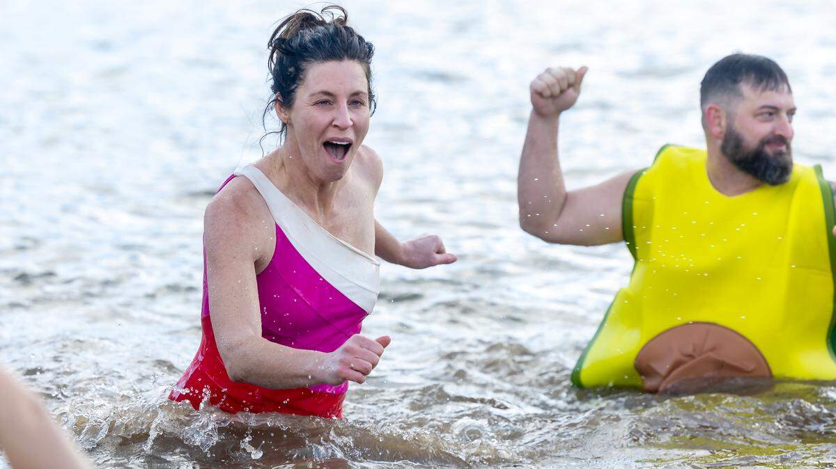 People run into and out of the cold water for the 22nd Annual Gebert-Arbaugh Great Polar Bear Challenge held at Spring Shores Marina at Lucky Peak State Park on Saturday, Jan. 11, 2025.