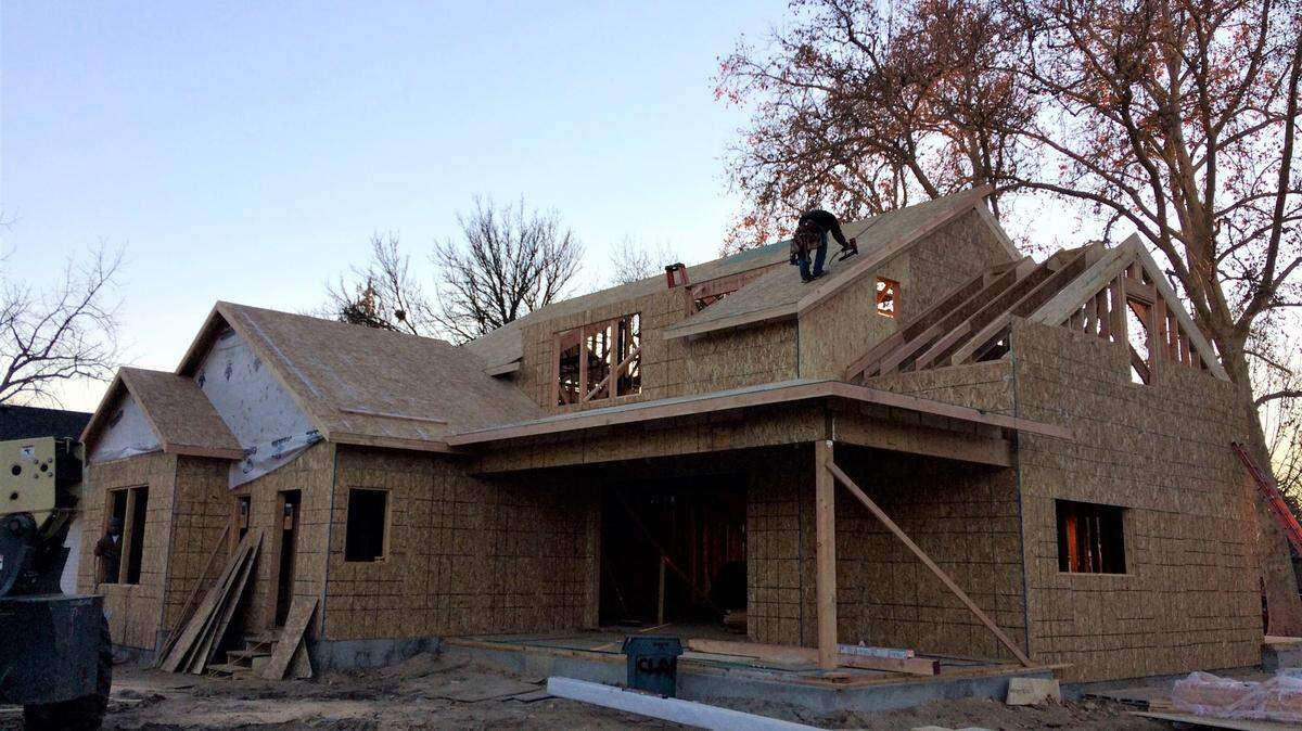 A construction worker works on the roof of a house being built at 20th and Irene streets in Boise’s North End, Dec. 3, 2020.