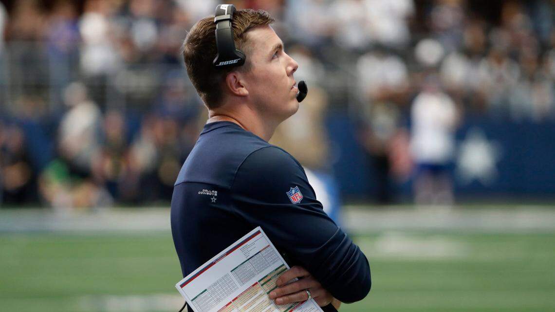 Dallas Cowboys offensive coordinator Kellen Moore stands on the sideline before the Cowboys’ game against the Carolina Panthers on Sunday in Arlington, Texas. The Cowboys won 36-28.