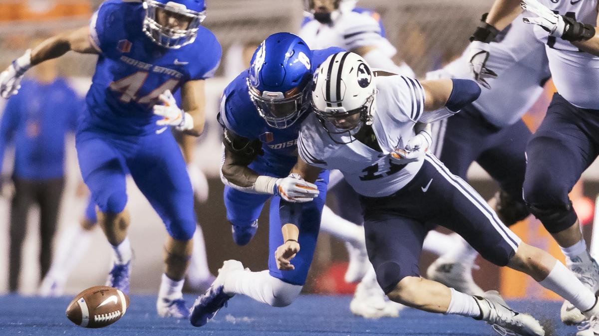 Boise State linebacker Jabril Frazier fights for a muffed snap with Brigham Young quarterback Zach Wilson late in the second quarter Saturday at Albertsons Stadium in Boise. Frazier came up with the ball.