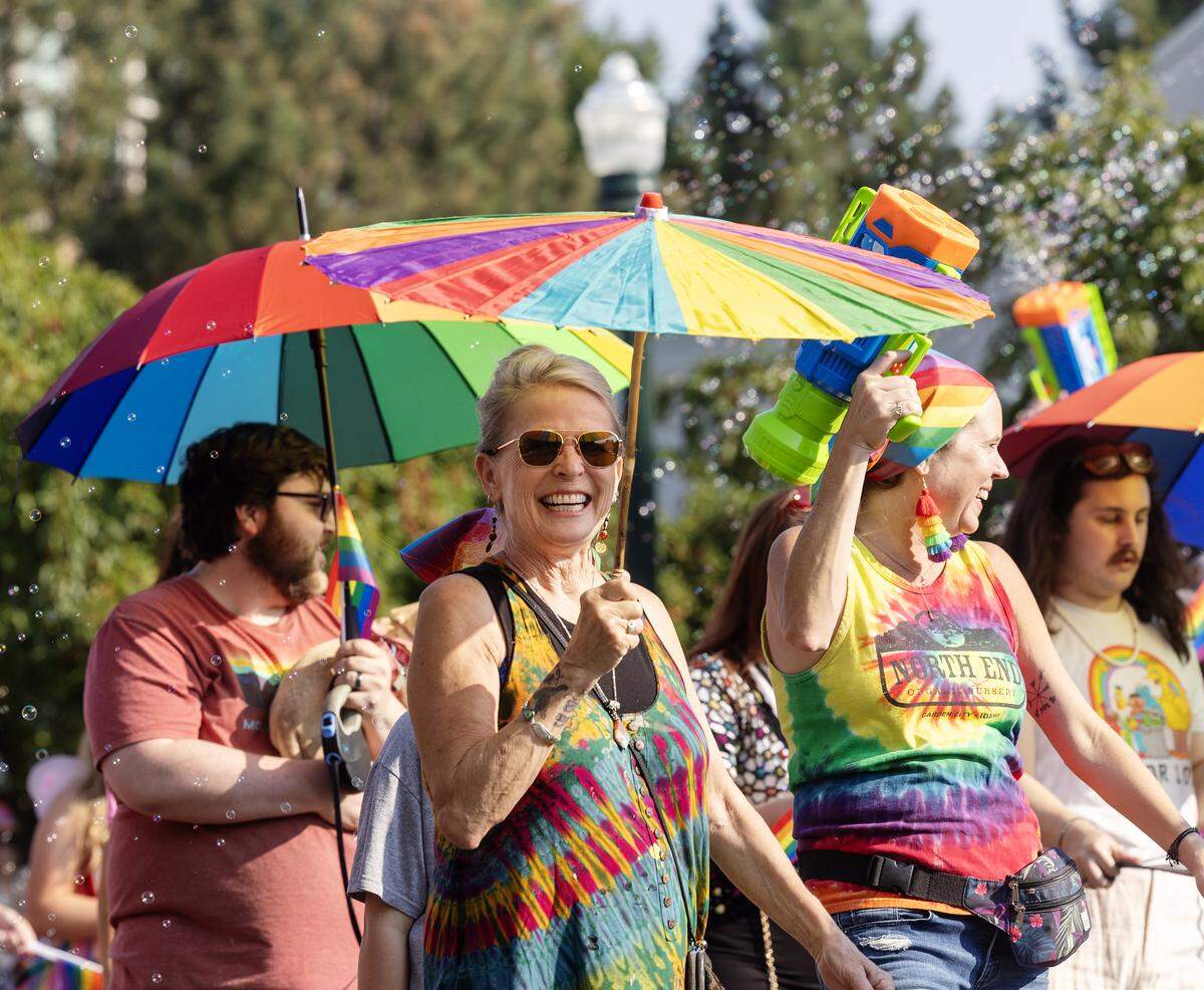 People walk in the Boise Pride parade.