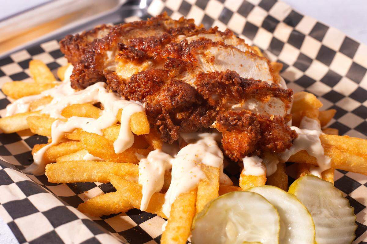 Chicken. Fries. Sauce. Pickles. “It’s your Clucky day,” as the restaurant says.