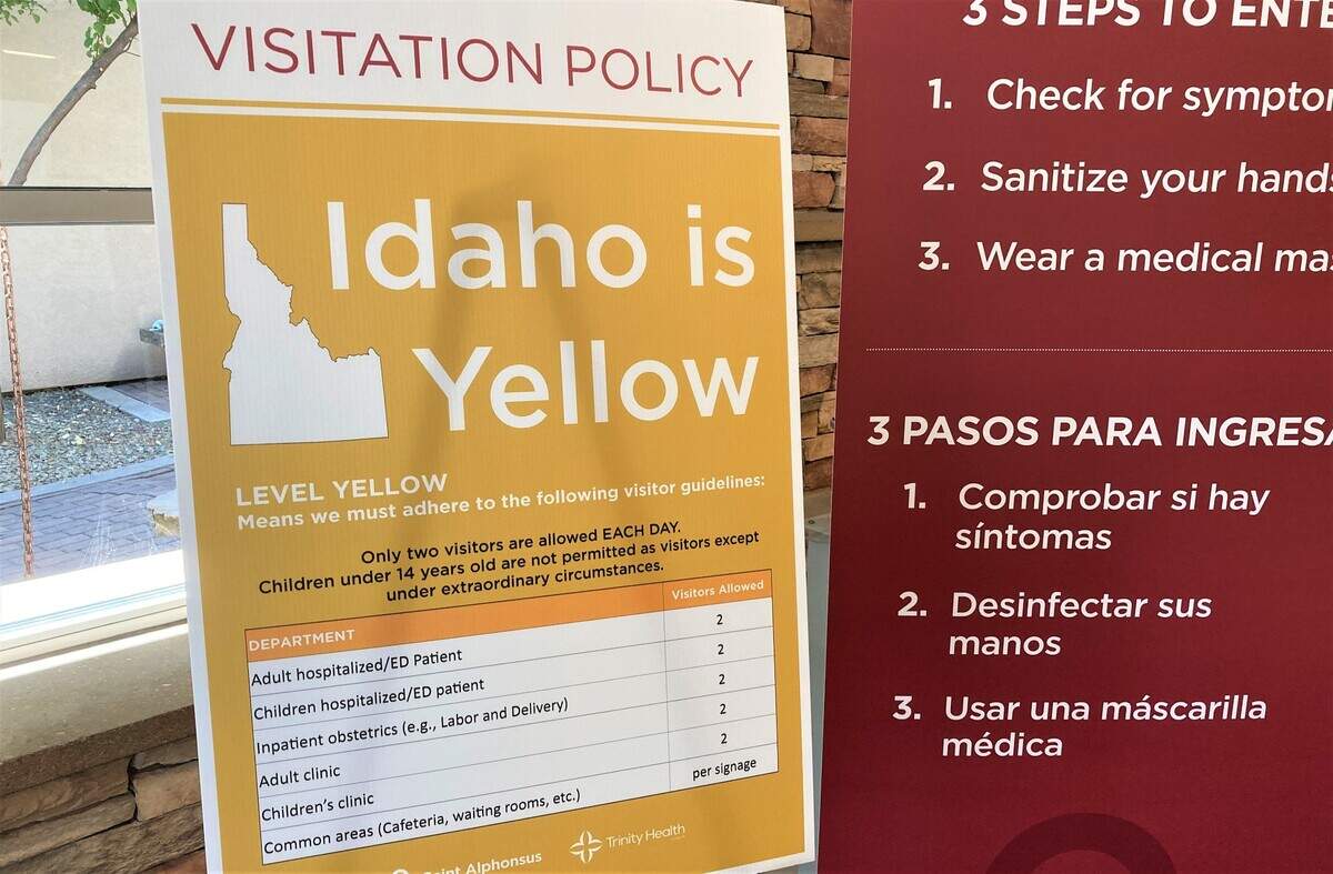 A sign at an entrance to the Saint Alphonsus Regional Medical Center in Boise on Aug. 25, 2022, notifies visitors of COVID-19 restrictions still in effect.