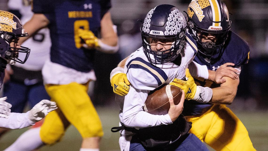 Middleton would drop a level to a newly branded 5A in the latest Idaho high school classification system that passed a preliminary vote Wednesday from the Idaho High School Activities Association. Above, Vikings quarterback Dekker Hagler gets caught by two Meridian defenders in the 5A state quarterfinals last fall.