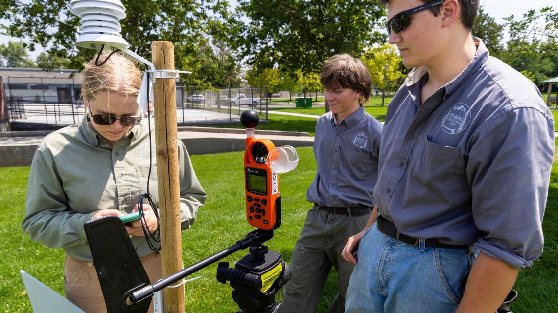 The youth crew records data from a fixed weather monitoring station at Borah Park in Boise to measure how trees can affect heat.