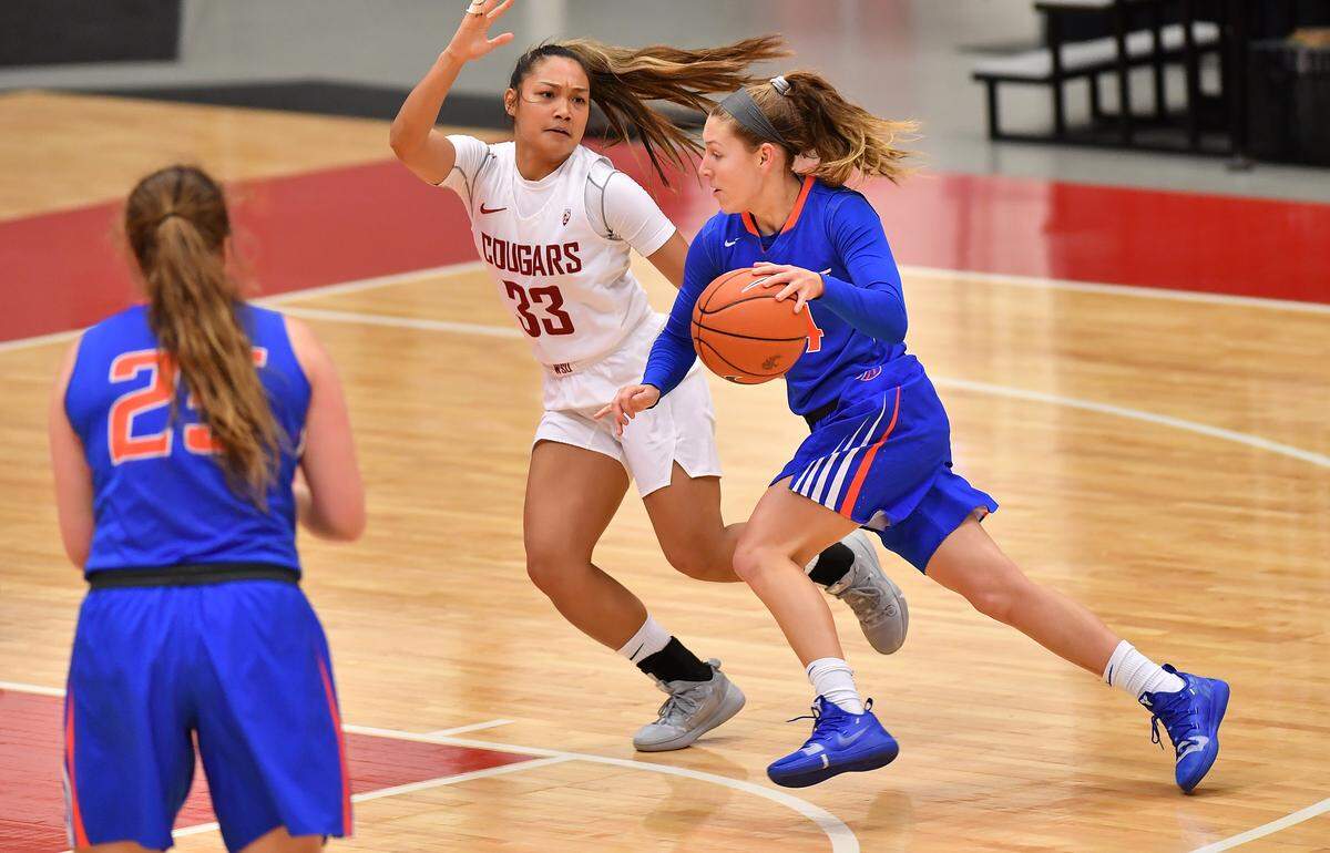 Boise State guard Braydey Hodgins drives to the basket against Washington State’s Cherilyn Molina on Saturday at Beasley Coliseum in Pullman, Wash.