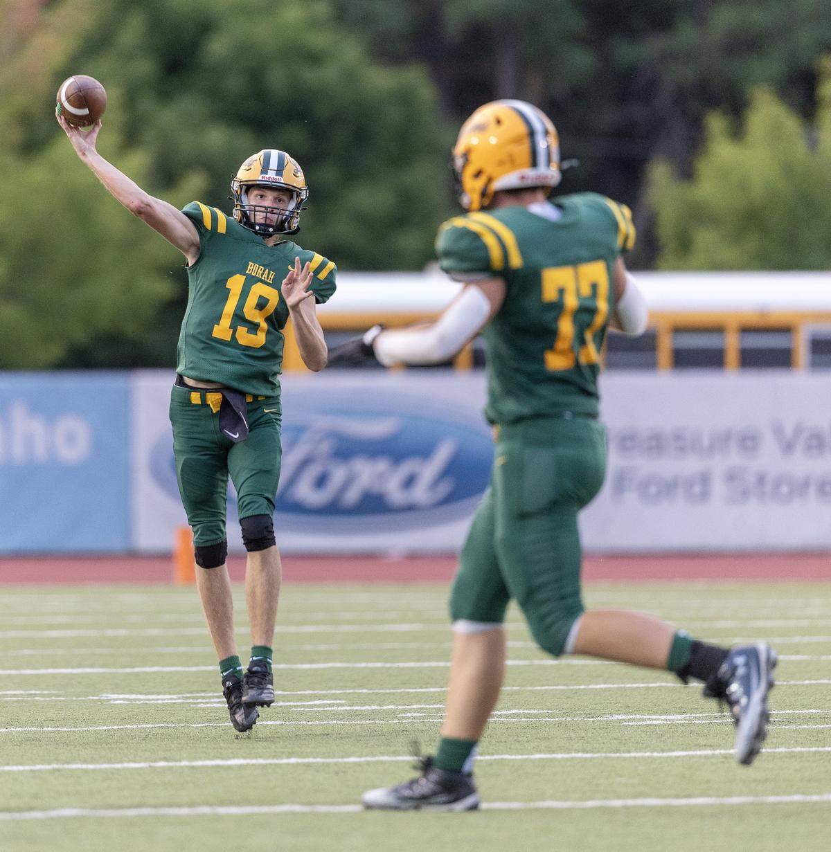 Borah junior quarterback Dayton Wolverton throws the ball in the first half their football game against Timberline at Dona Larsen Park, Friday, August 29, 2025.