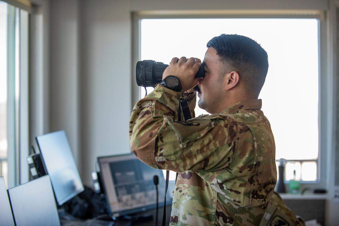 An observer watches exercises performed on the Idaho National Guard’s Digital Air-Ground Integration Range at the Orchard Combat Training Center south of Boise. The range allows simultaneous exercises by air and ground troops with real-time evaluation of their actions.