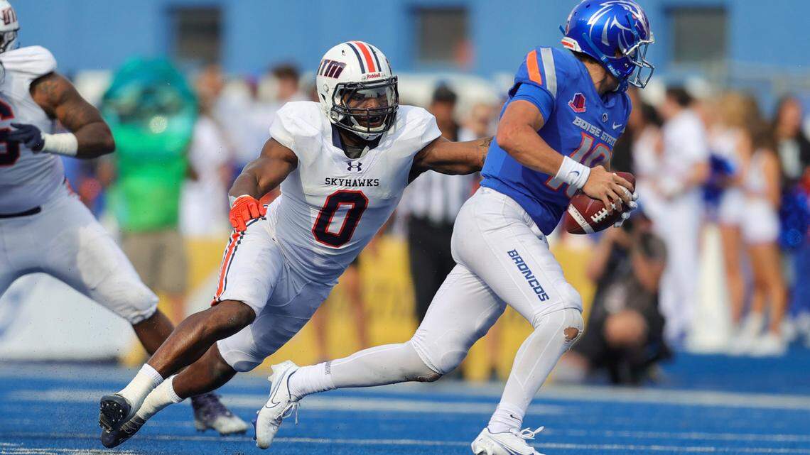 Boise State quarterback Hank Bachmeier tries to escape UT Martin linebacker TJ Neal during the Broncos’ home opener against the Skyhawks.