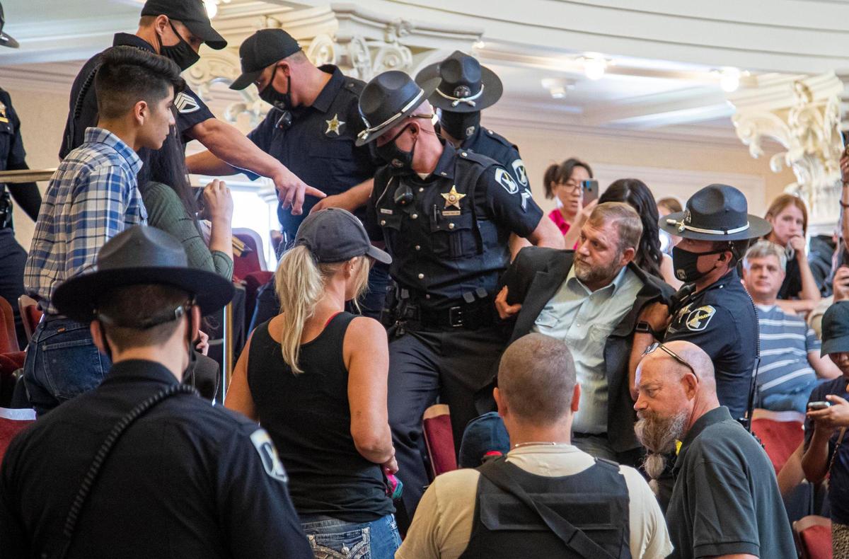 Ammon Bundy is dragged from the Idaho Senate gallery by Idaho State Police after returning to the Idaho Statehouse on Aug. 26, 2020.
