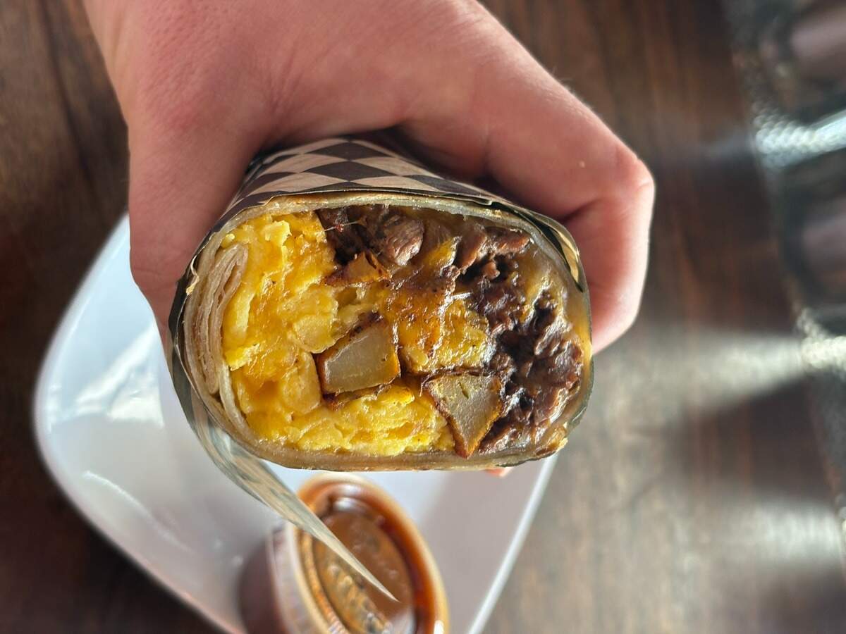 The Normal Guy burrito is filled with scrambled eggs, seasoned Idaho potatoes and cheddar cheese, but you can add steak, too.