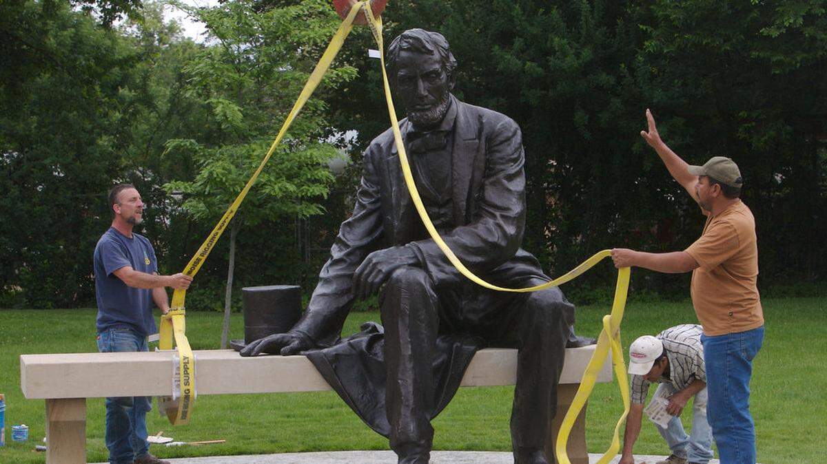 Workers place one of the largest seated bronze statues of Abraham Lincoln in the country in Julia Davis Park in this file photo from June 10, 2010. The public unveiling was on June 19, or Juneteenth.