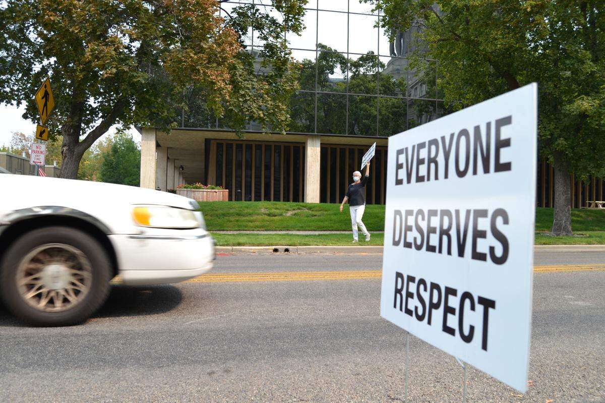 Eileen Oldag gets the crowd riled up Monday with honks and waves during Monday’s edition of the State Street Demonstration for American Values along State Street behind the Idaho State Capitol.