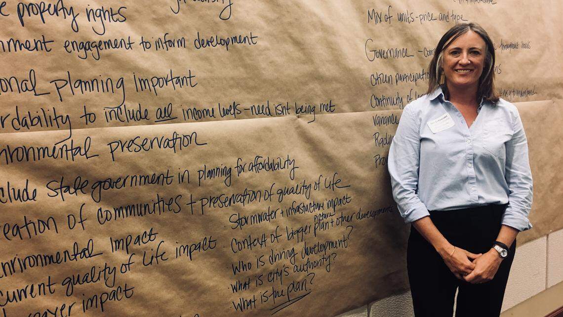 Jen Schneider, a professor in the Boise State University School of Public Service, has overseen the city’s workshops on growth. Saturday’s was at City Hall. She stands before a list of participants’ concerns.
