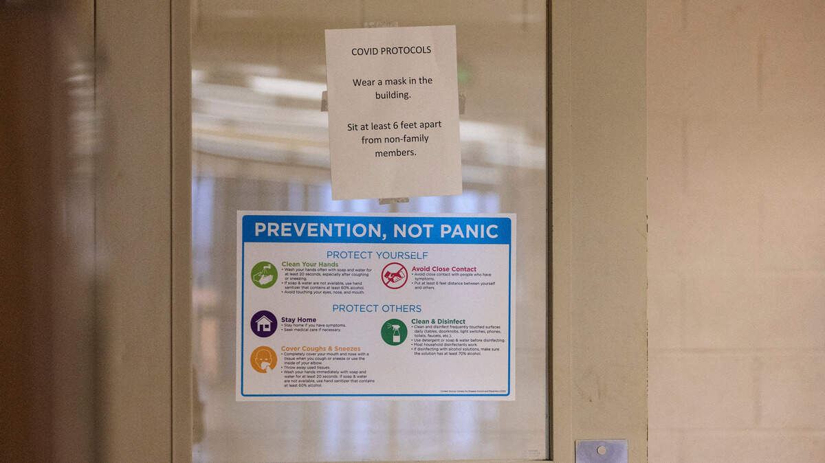 A sign posted on the gym door at Mountain View High School in Meridian reminds students to socially distance and wear face masks on Thursday, Sept. 9, 2021.