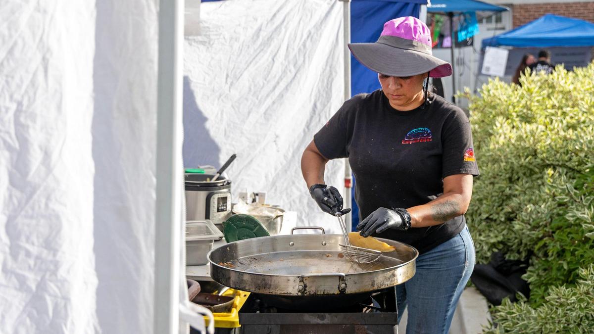 Ninfa Avalos makes empanadas at her vendor booth, Nina’s Empanadas, at the inaugural Viva Nampa Festival at Lloyd Square Park in downtown Nampa, Friday, June 27, 2025. The event was a collaboration between the 208 Night Market and the Downtown Nampa Association.